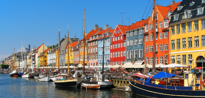 Cruise ship sailing through the Baltic Sea near a historic European city